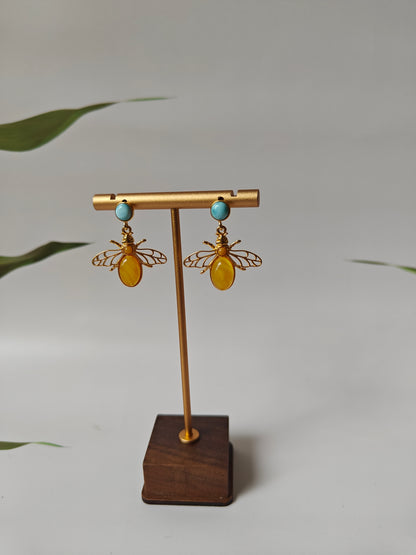 Bee Shaped Butterscotch Amber Stud Earrings with Larimar in Gold Plated Silver Frame