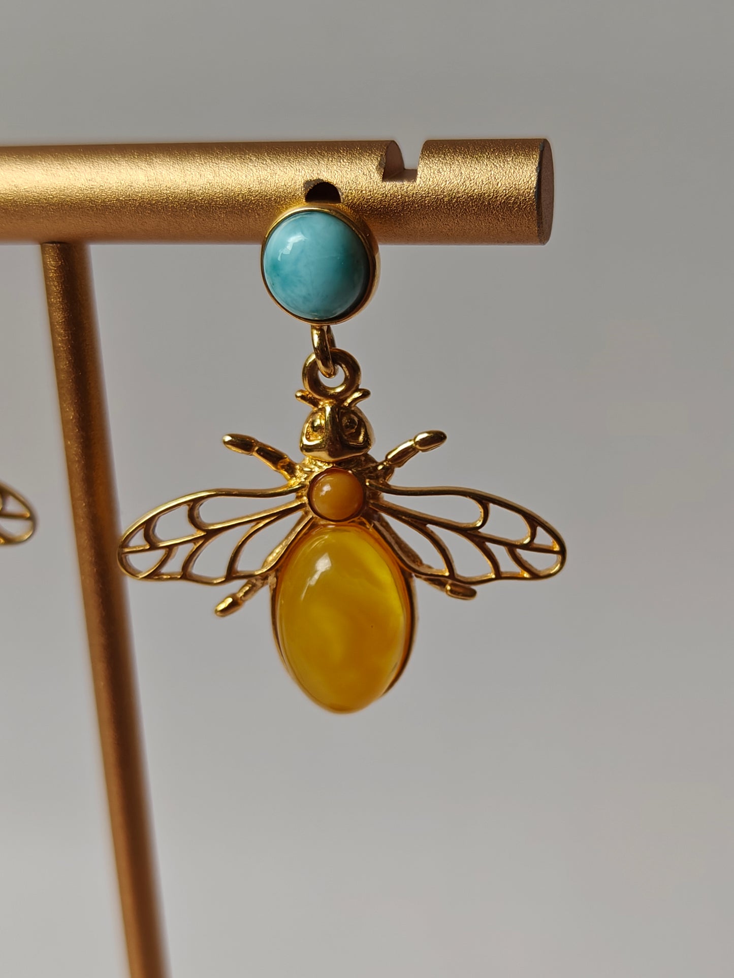 Bee Shaped Butterscotch Amber Stud Earrings with Larimar in Gold Plated Silver Frame