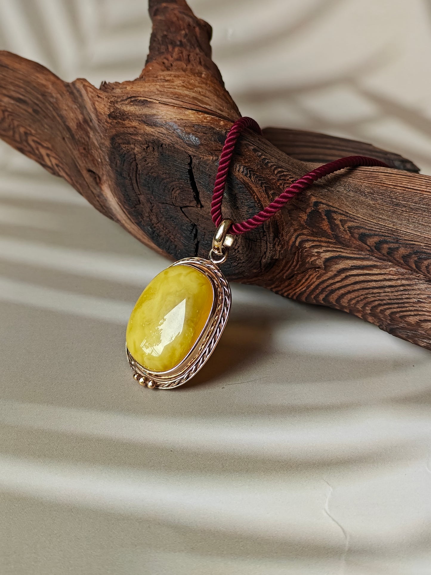 Butterscotch Amber Pendant in Rose Gold Pleated Silver Frame