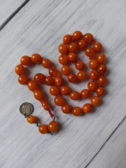German Bakelite Carvacraft Tasbih – 39 Pigeon-Egg Beads | Turkish Craft | Silver Coin Tassel | Deep Honey Color with Transparent Veins