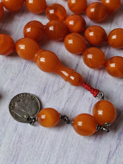 German Bakelite Carvacraft Tasbih – 39 Pigeon-Egg Beads | Turkish Craft | Silver Coin Tassel | Deep Honey Color with Transparent Veins