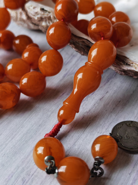 German Bakelite Carvacraft Tasbih – 39 Pigeon-Egg Beads | Turkish Craft | Silver Coin Tassel | Deep Honey Color with Transparent Veins