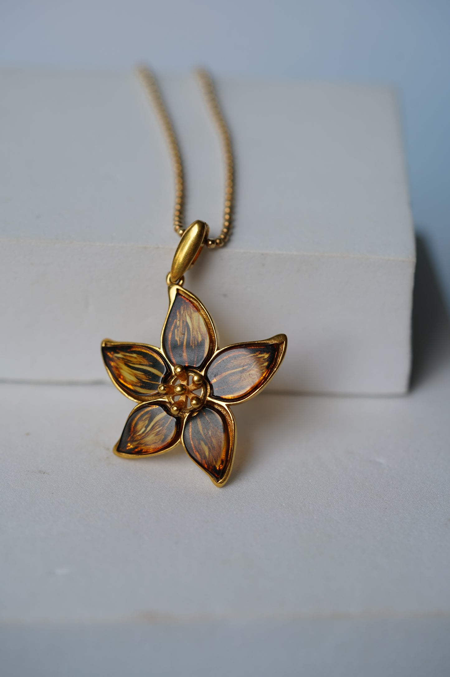 Flower Shaped Cognac Amber Pendant With Gold Plated Silver Frame