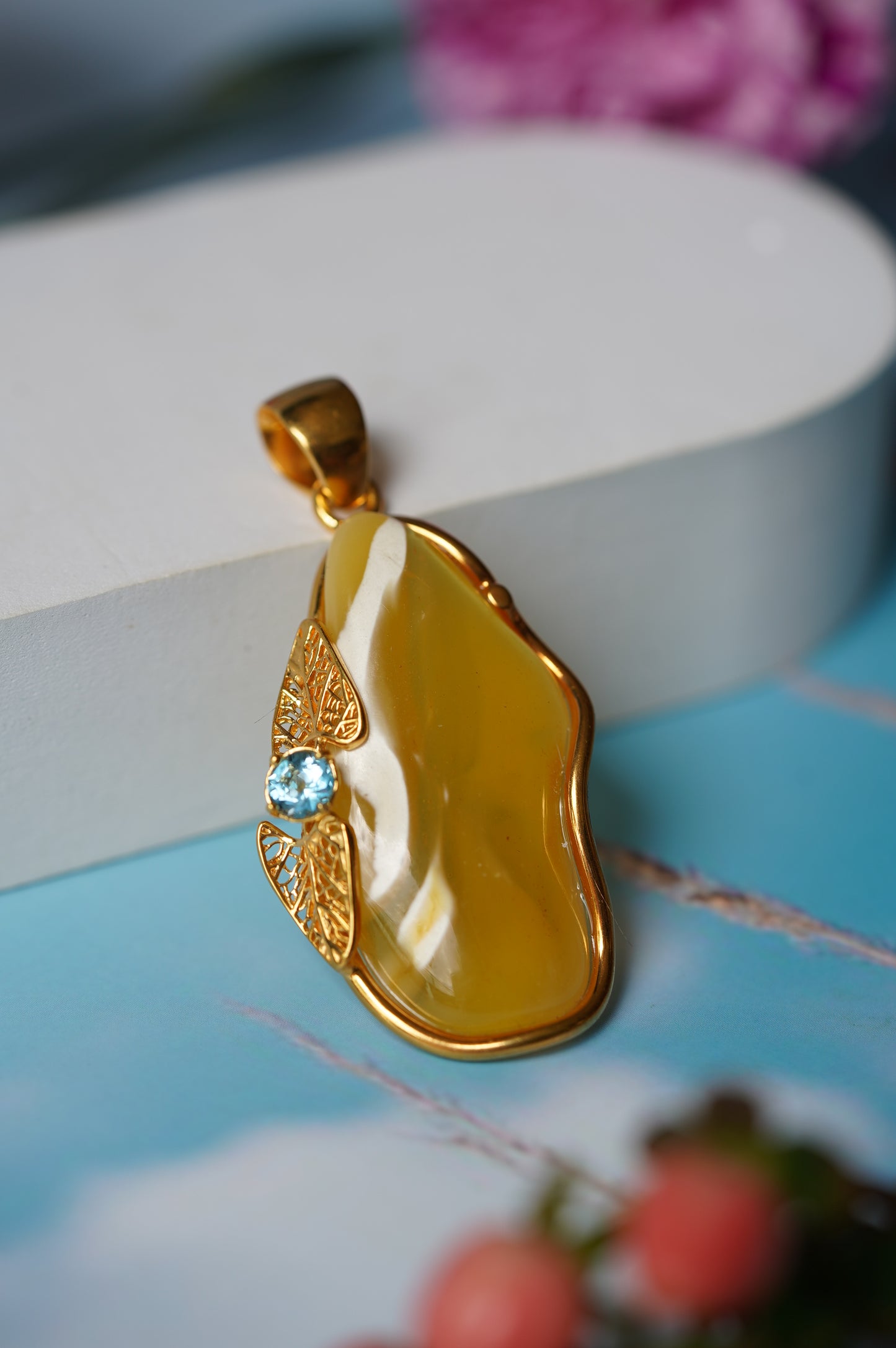 Natural Irregular Honey / Royal White Amber Pendant in Gold Plated Silver Frame with Blue Topaz