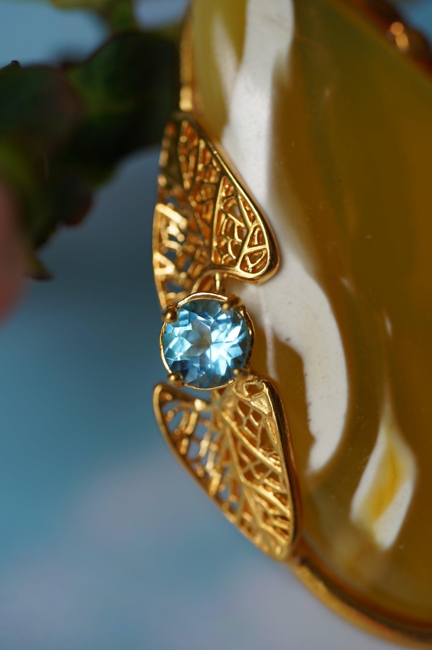 Natural Irregular Honey / Royal White Amber Pendant in Gold Plated Silver Frame with Blue Topaz