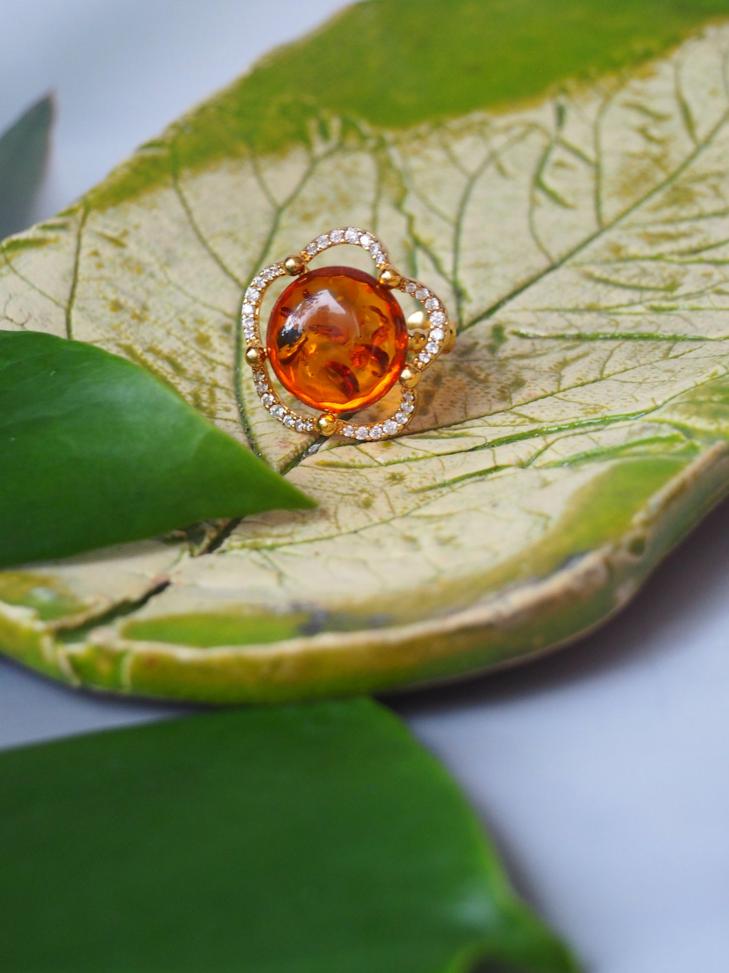 Delicate Flower Shaped Cognac Amber Ring with Cubic Zirconia in Gold Plated Silver