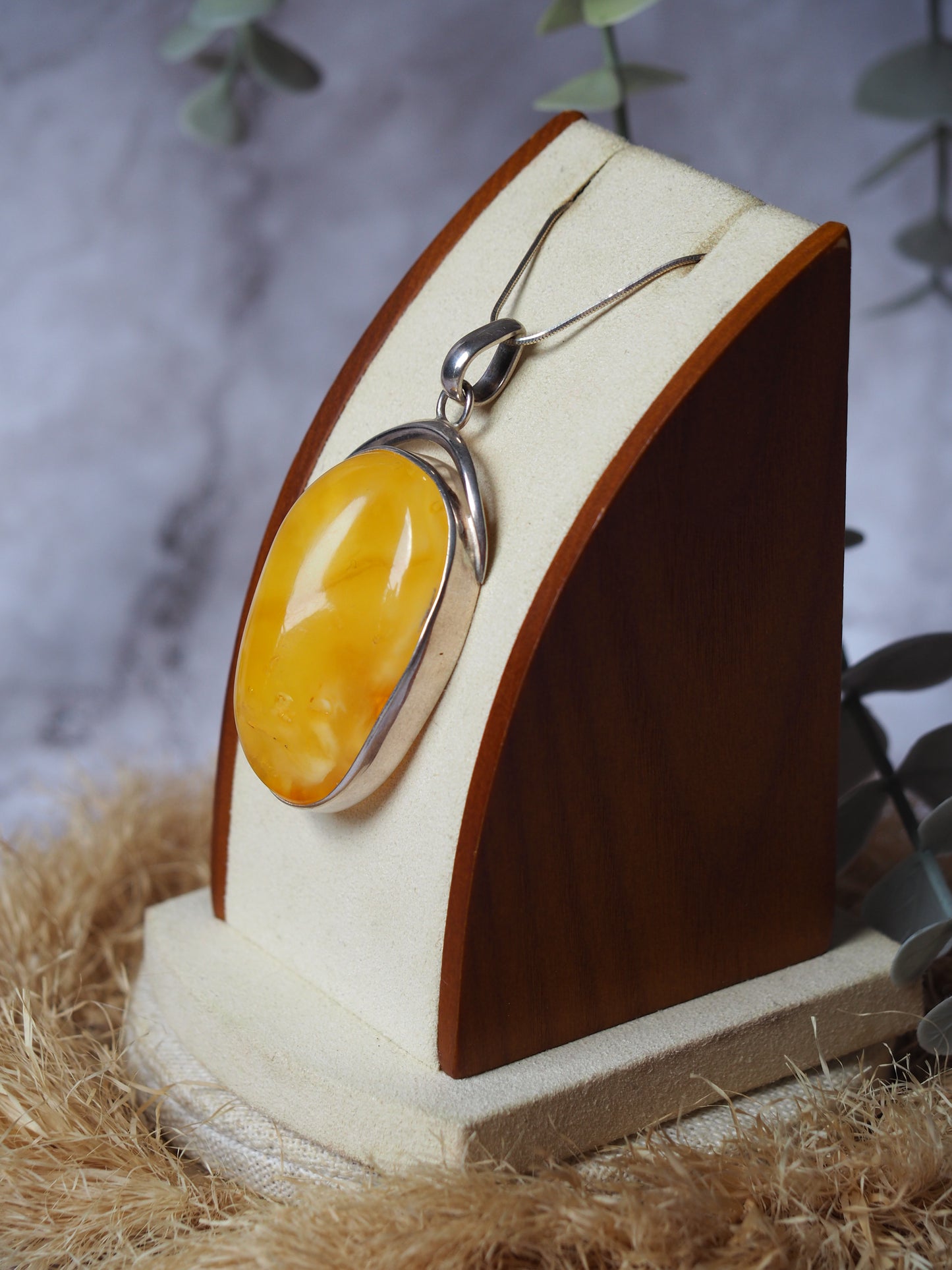 Natural butterscotch Amber Pendant with Raw Back in Silver Frame