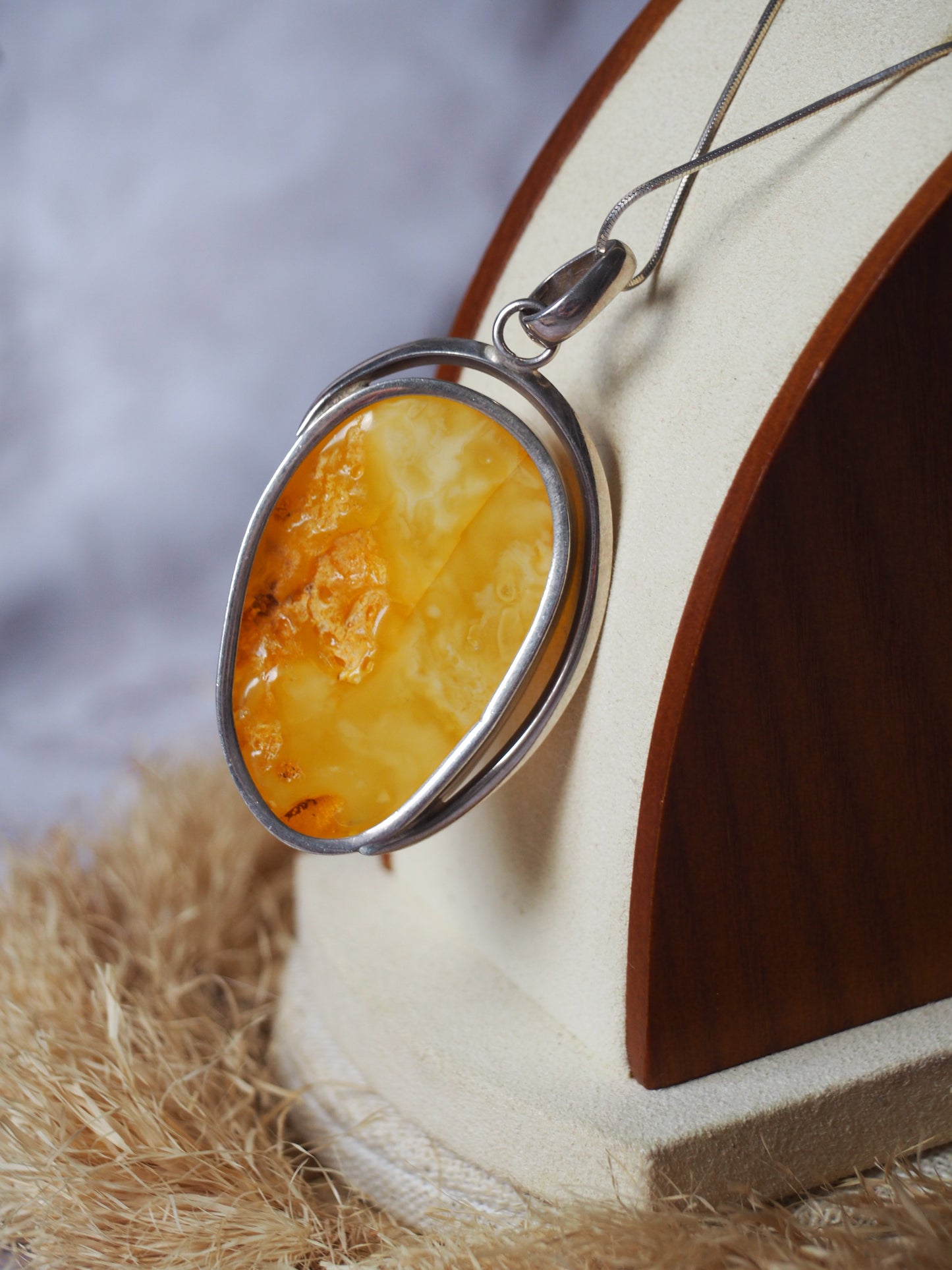 Natural butterscotch Amber Pendant with Raw Back in Silver Frame