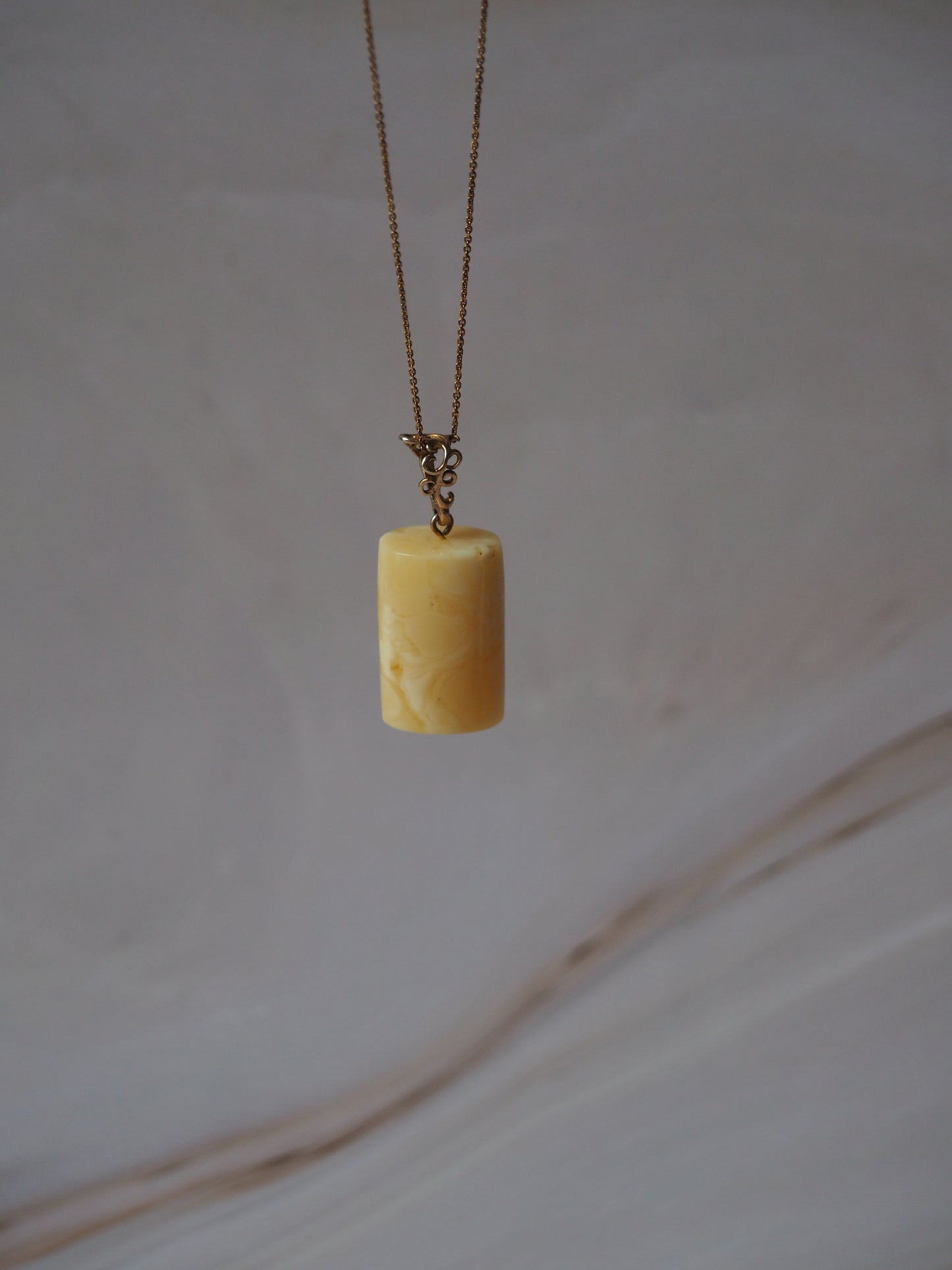 Natural Milk Amber Cylinder Shape Pendant in Gold Plated Silver