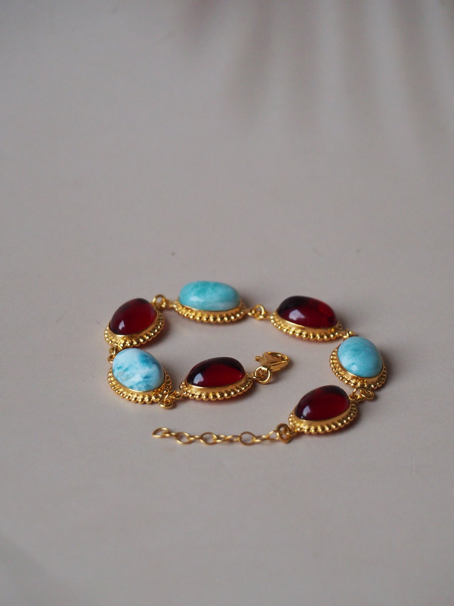 Red Amber and Larimar Bracelet in Gold Plated Silver
