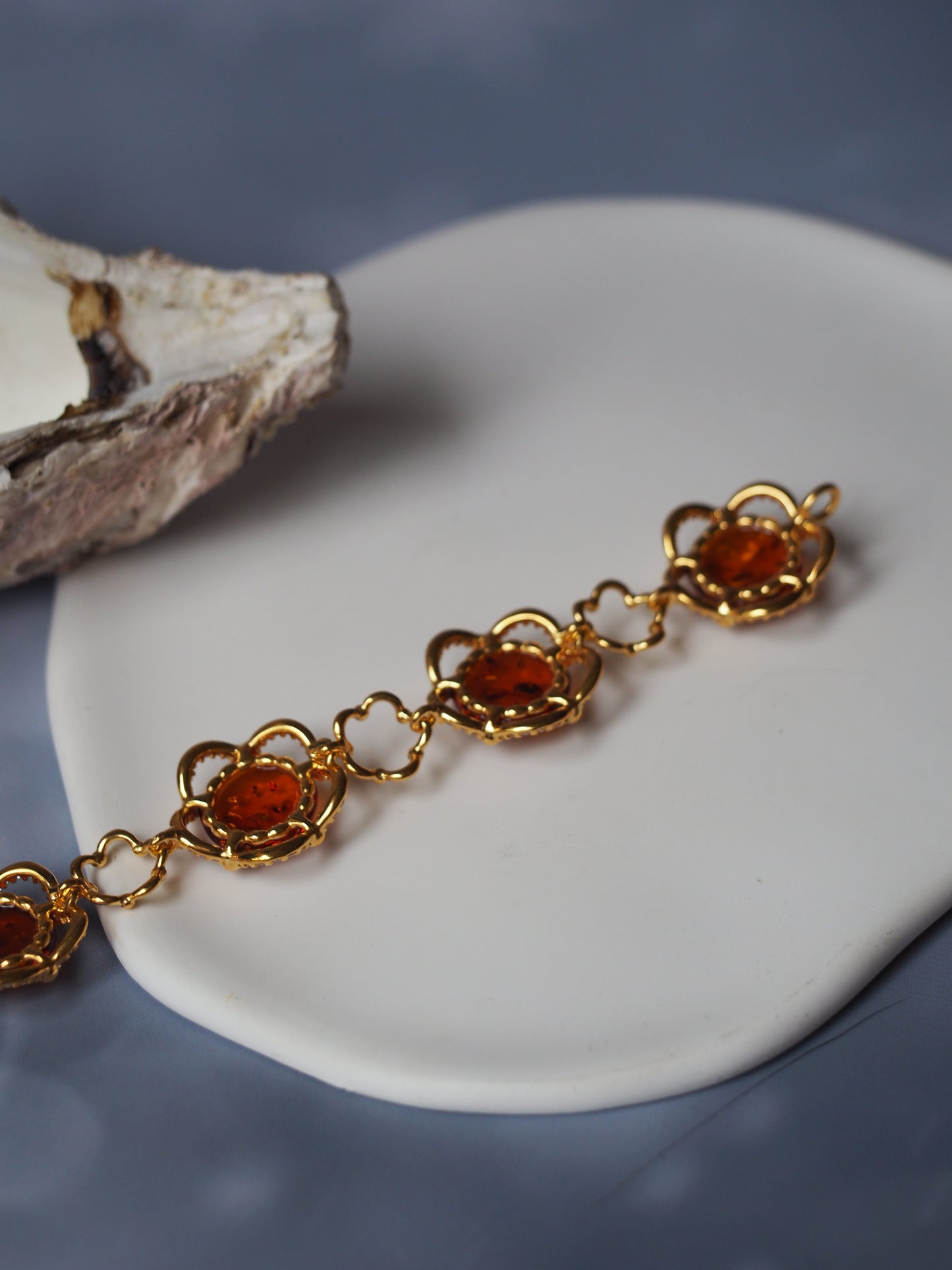 Delicate Flower Shaped Cognac Amber Bracelet with Cubic Zirconia in Gold Plated Silver