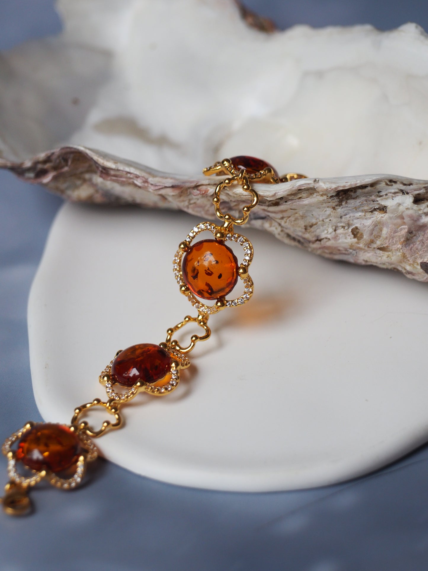 Delicate Flower Shaped Cognac Amber Bracelet with Cubic Zirconia in Gold Plated Silver