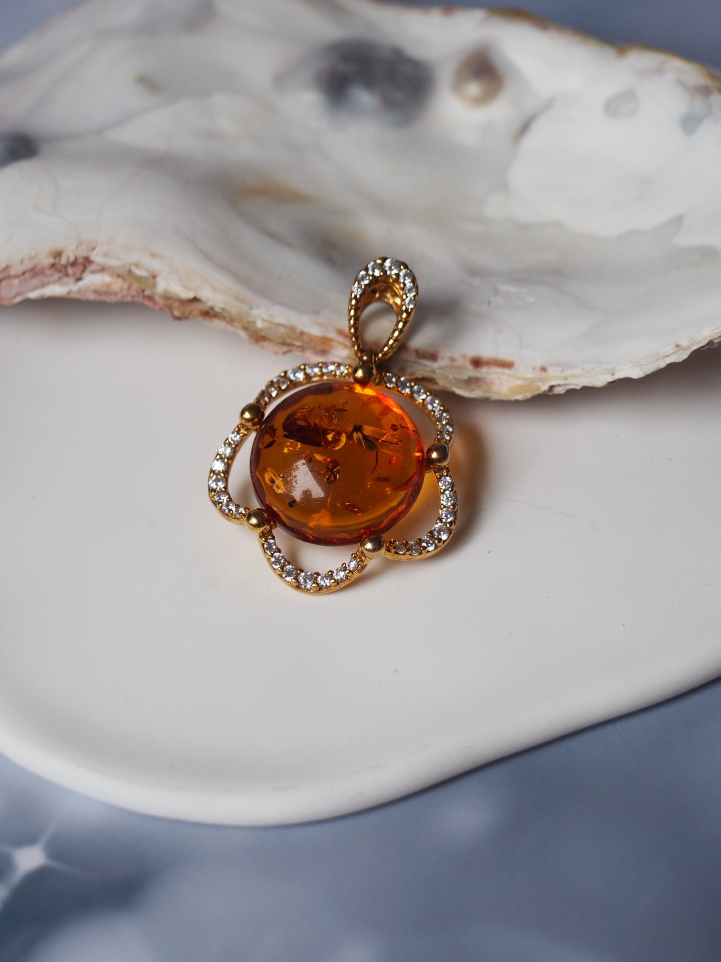 Delicate Flower Shaped Cognac Amber Pendant with Cubic Zirconia in Gold Plated Silver