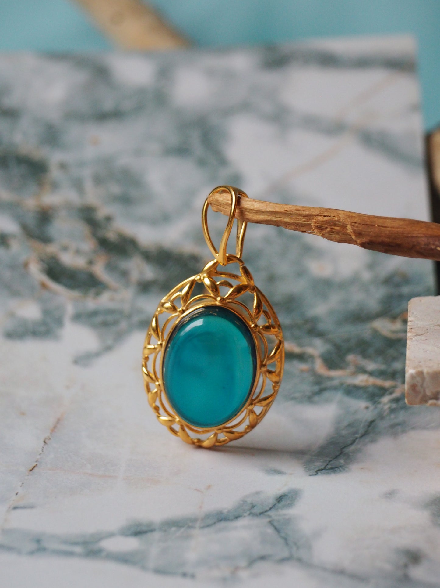 Bright Blue Amber Pendant in Gold Plated Silver