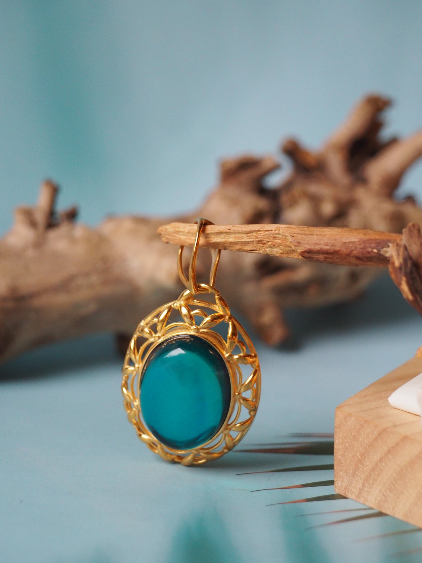 Bright Blue Amber Pendant in Gold Plated Silver