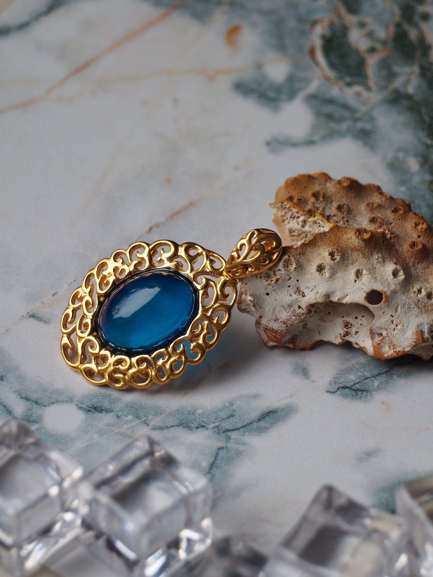 Elegant Blue Amber Oval Pendant in Golden Embroidery