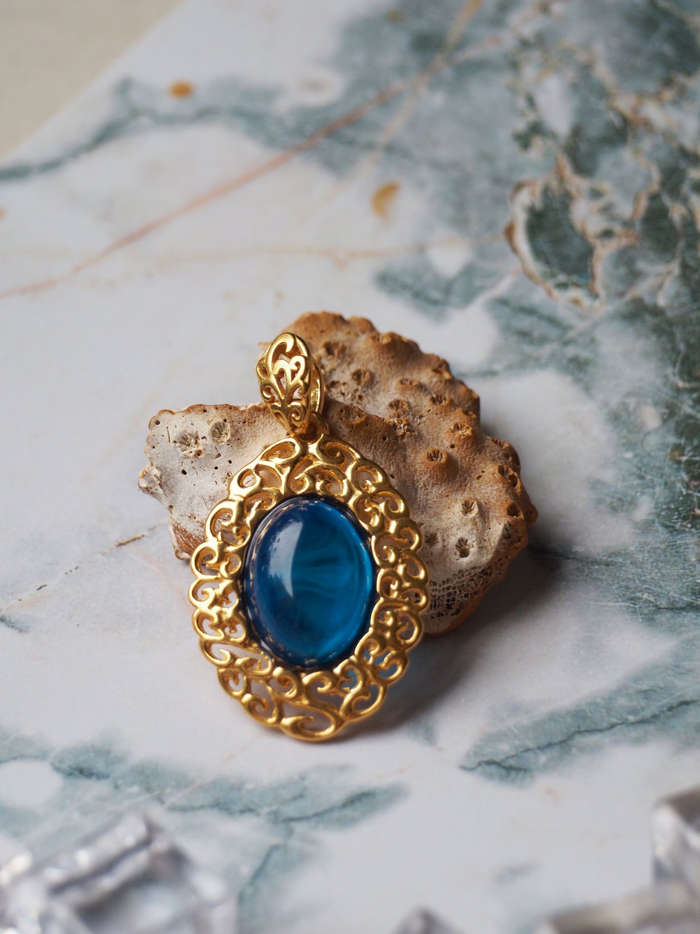 Elegant Blue Amber Oval Pendant in Golden Embroidery