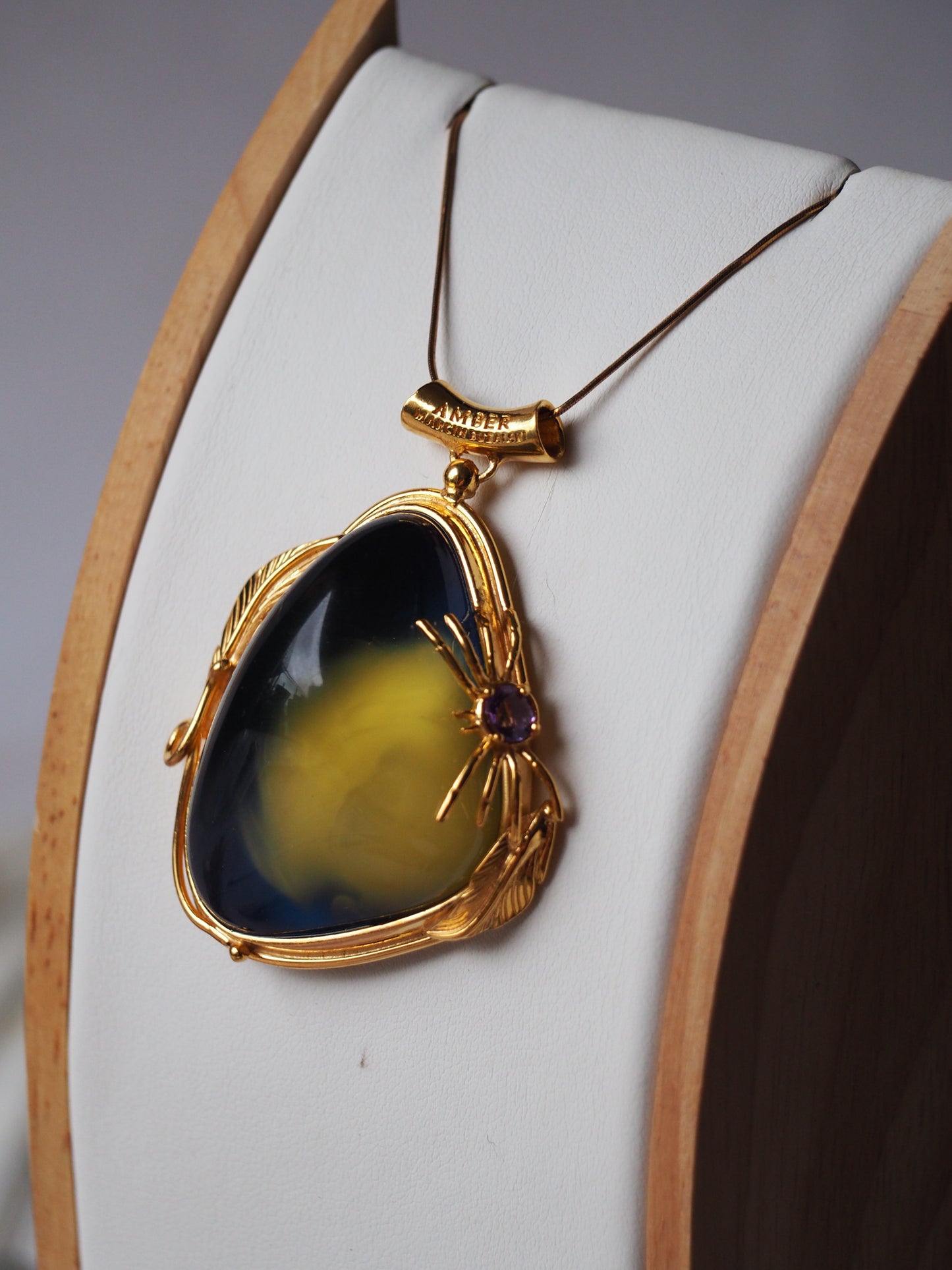 Unique Blue Amber Pendant with Milk Inclusion in Gold Plated Silver
