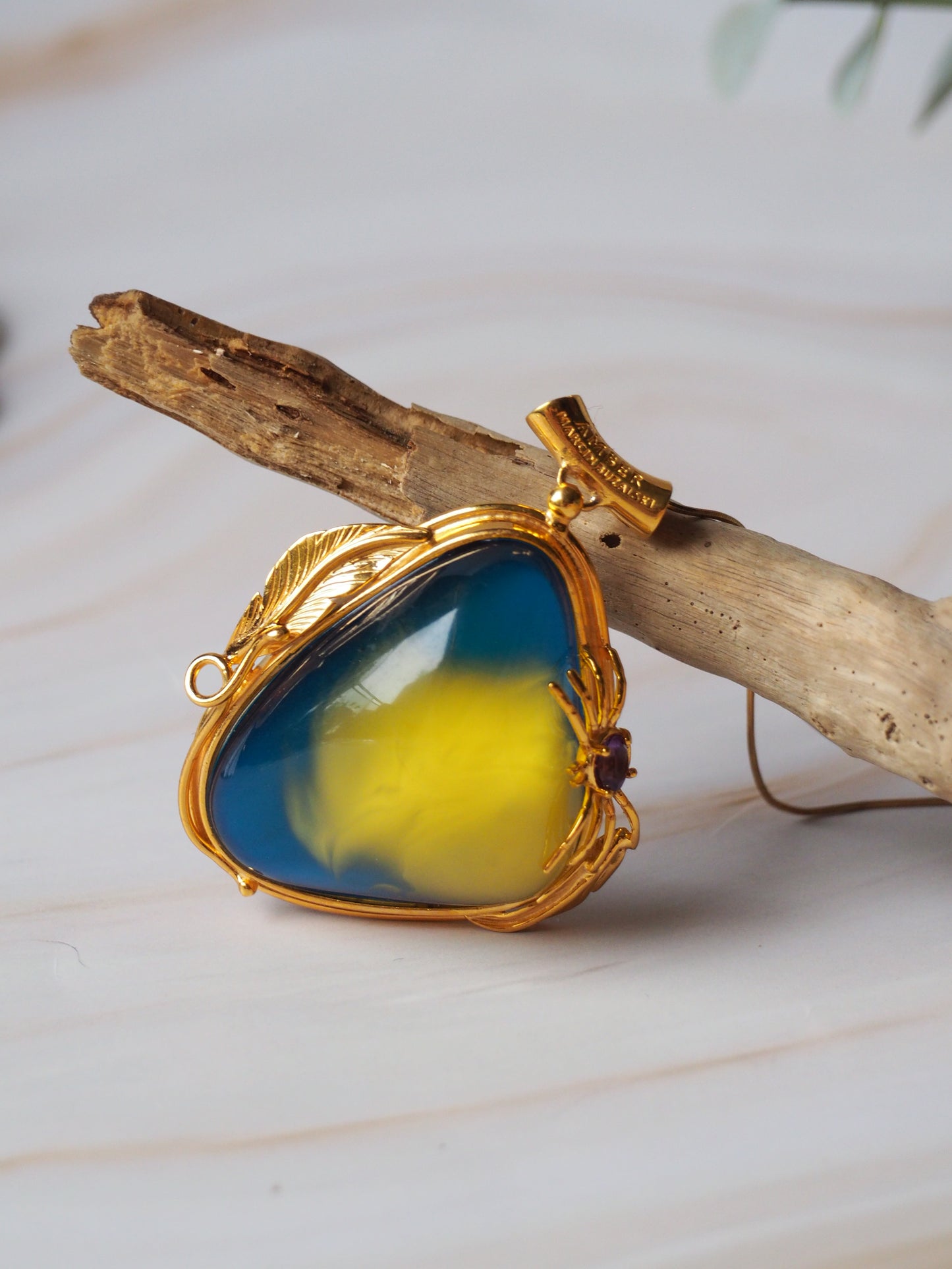 Unique Blue Amber Pendant with Milk Inclusion in Gold Plated Silver