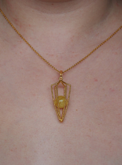 Geometric Cage Pendant With Butterscotch Amber And Gold Plated Silver