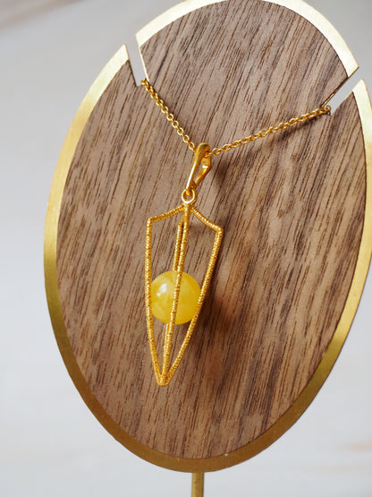 Geometric Cage Pendant With Butterscotch Amber And Gold Plated Silver