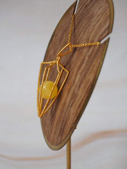 Geometric Cage Pendant With Butterscotch Amber And Gold Plated Silver