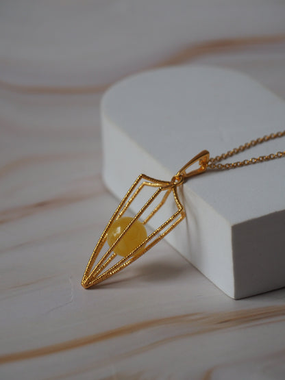 Geometric Cage Pendant With Butterscotch Amber And Gold Plated Silver