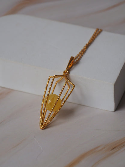 Geometric Cage Pendant With Butterscotch Amber And Gold Plated Silver