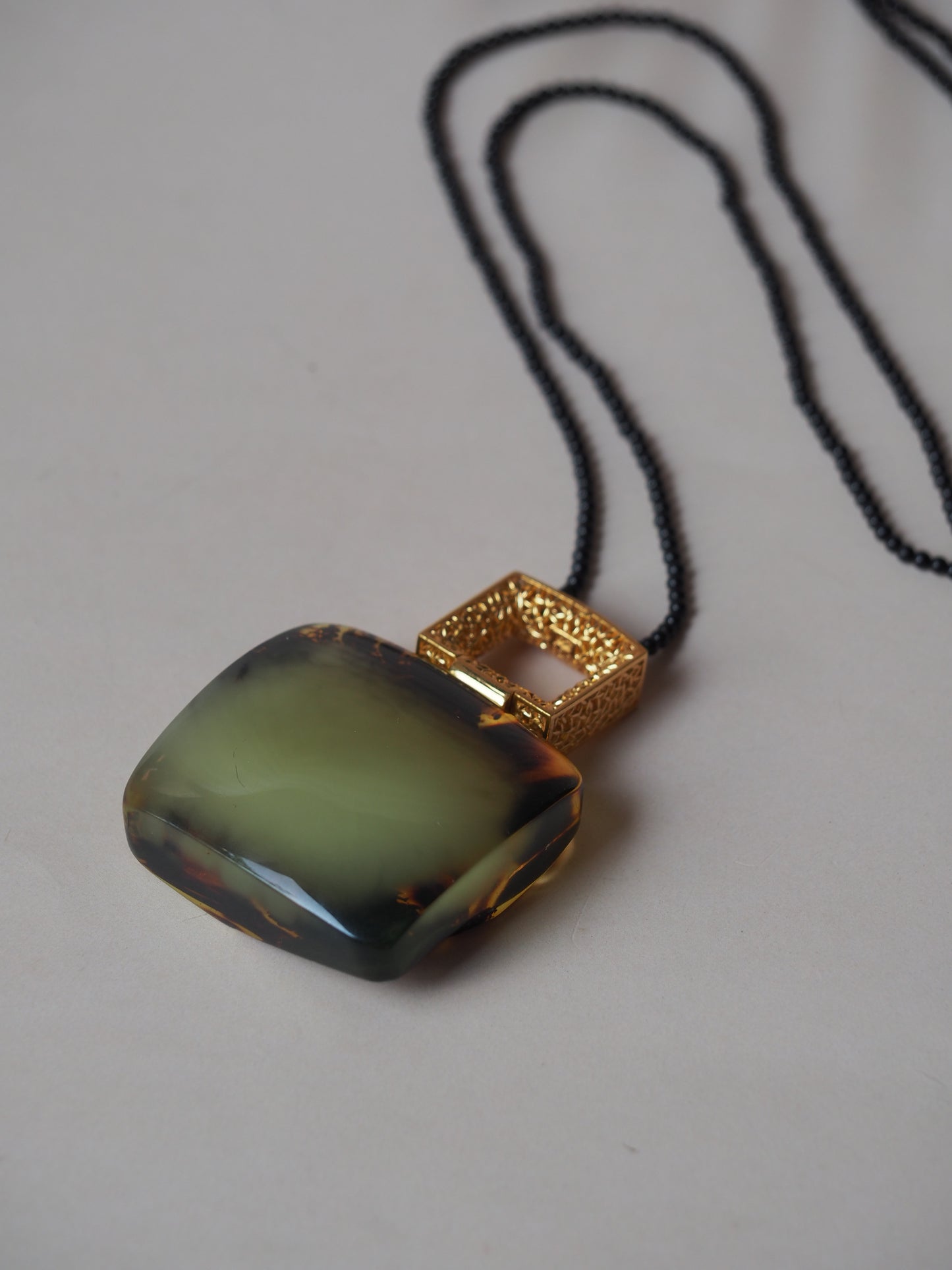 Huge Green Amber Necklace with Black Onyx Necklace and Gold Plated Frame