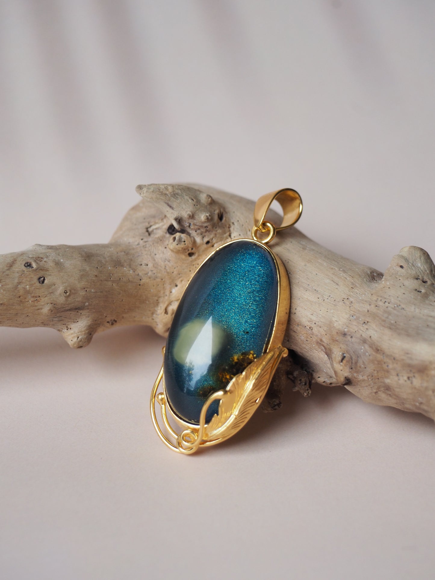 Unique Blue Amber Oval Pendant with Milk Inclusion and Sand Back