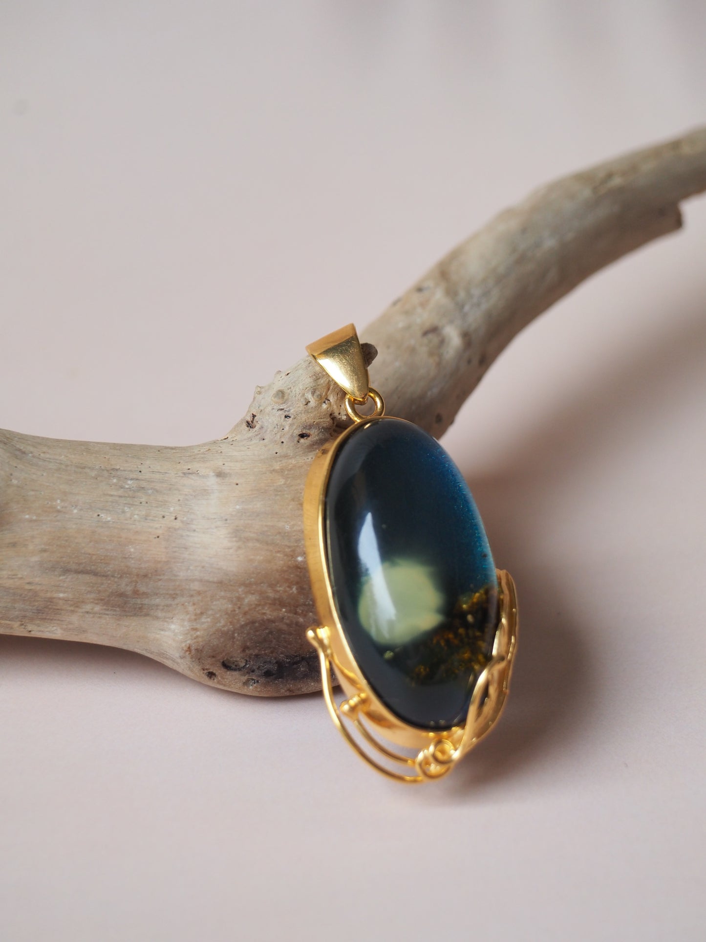 Unique Blue Amber Oval Pendant with Milk Inclusion and Sand Back