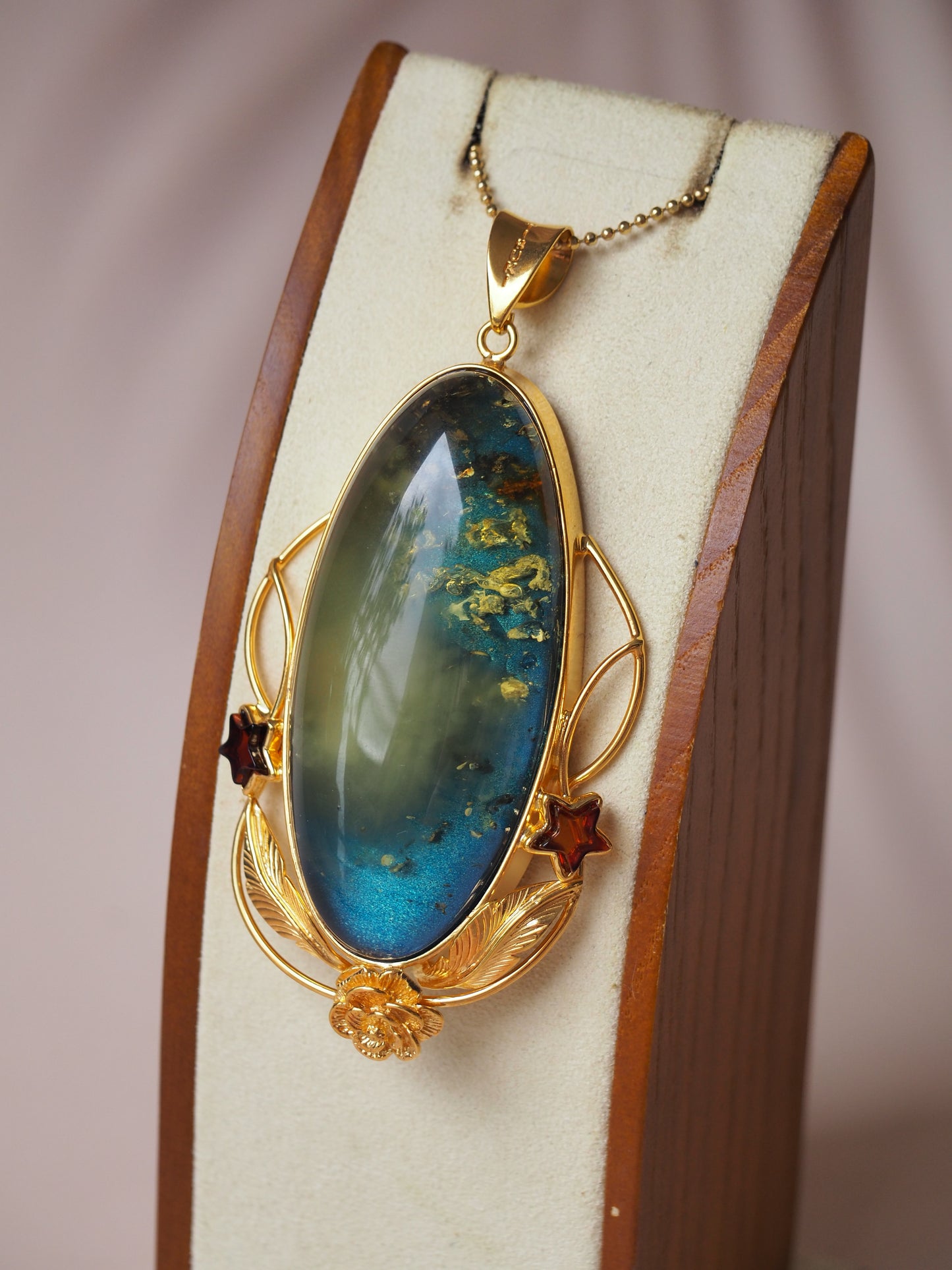 Large Unique Blue Amber Pendant with Milk Cloudy Inclusion and Cognac Stars in Gold Plated Silver