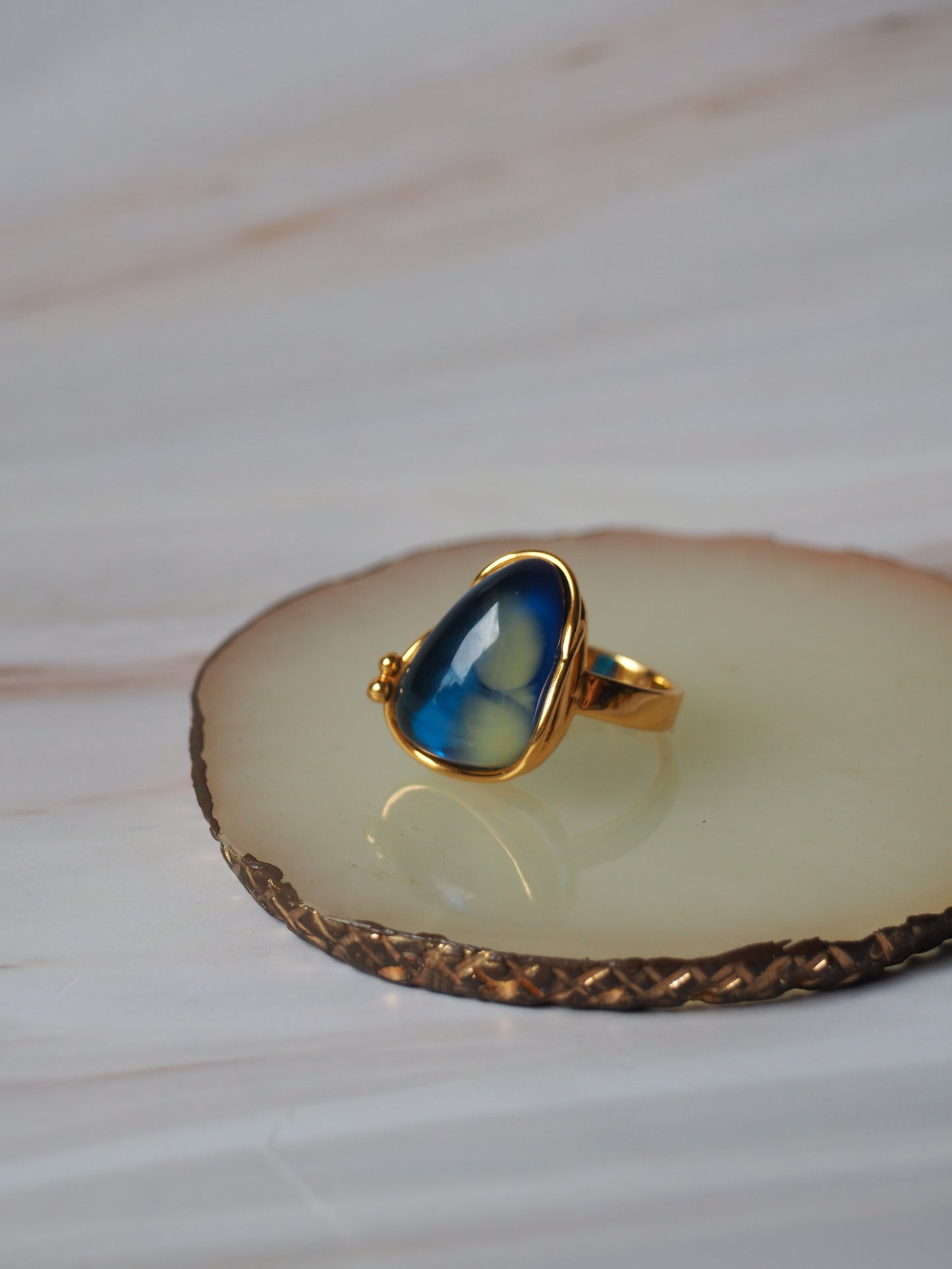 Unique Blue Amber Ring with Milk Inclusion in Gold Plated Silver