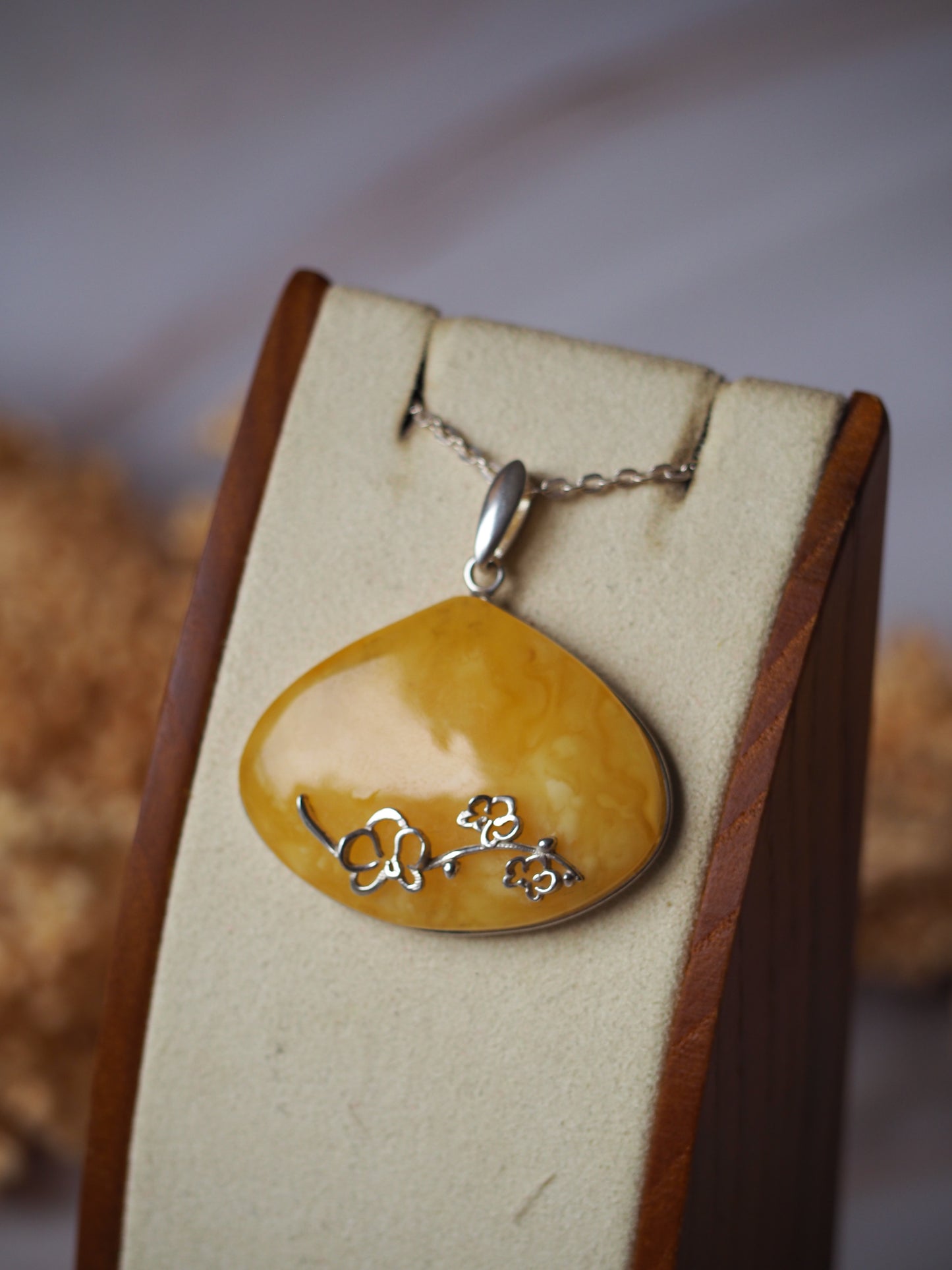 Wide Butterscotch Amber Pendant with Silver Embroidery
