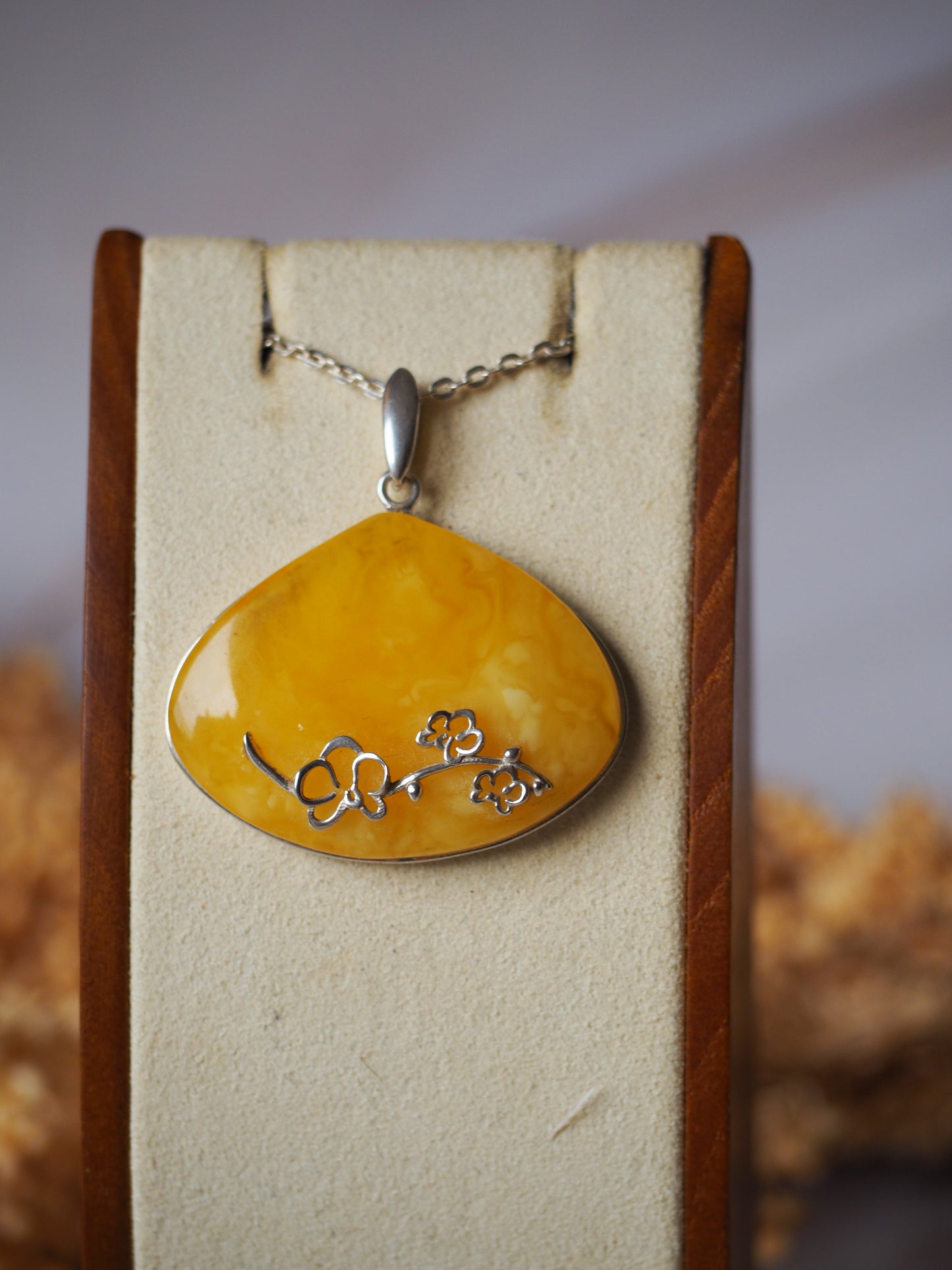 Wide Butterscotch Amber Pendant with Silver Embroidery