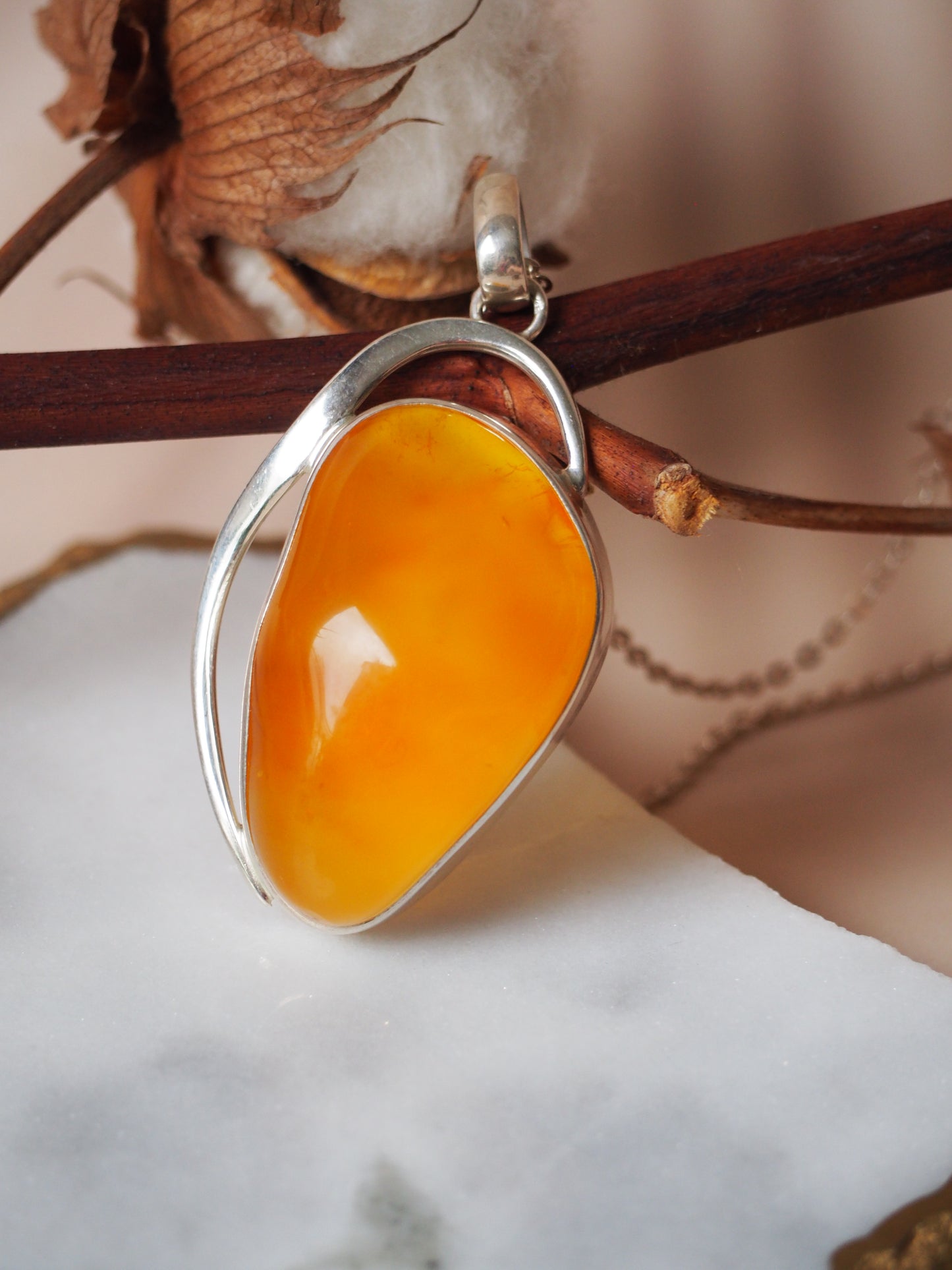 Natural Honey Amber Pendant in Silver Frame