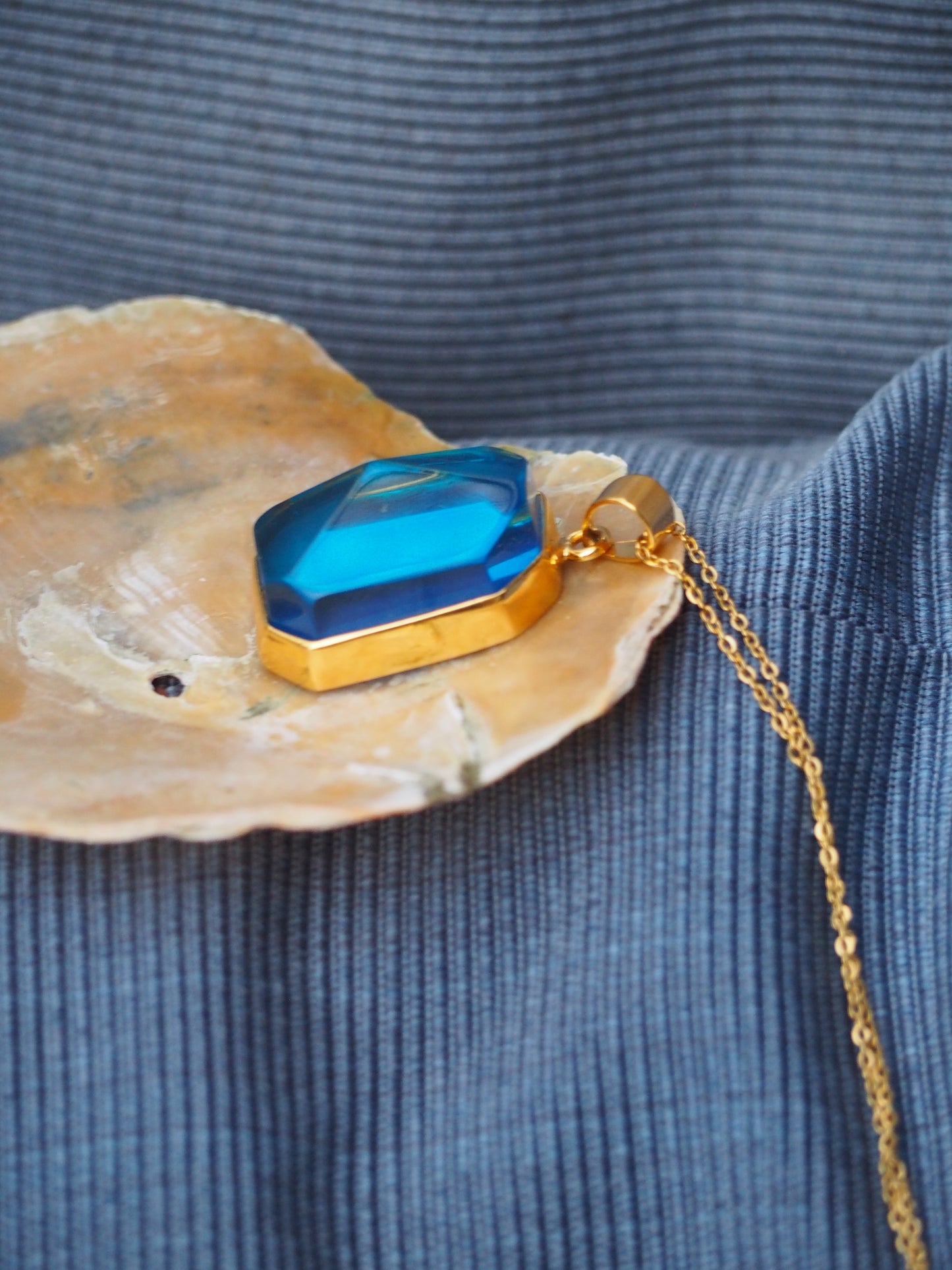Irregular Polished Blue Amber Pendant in Gold Pleated Silver