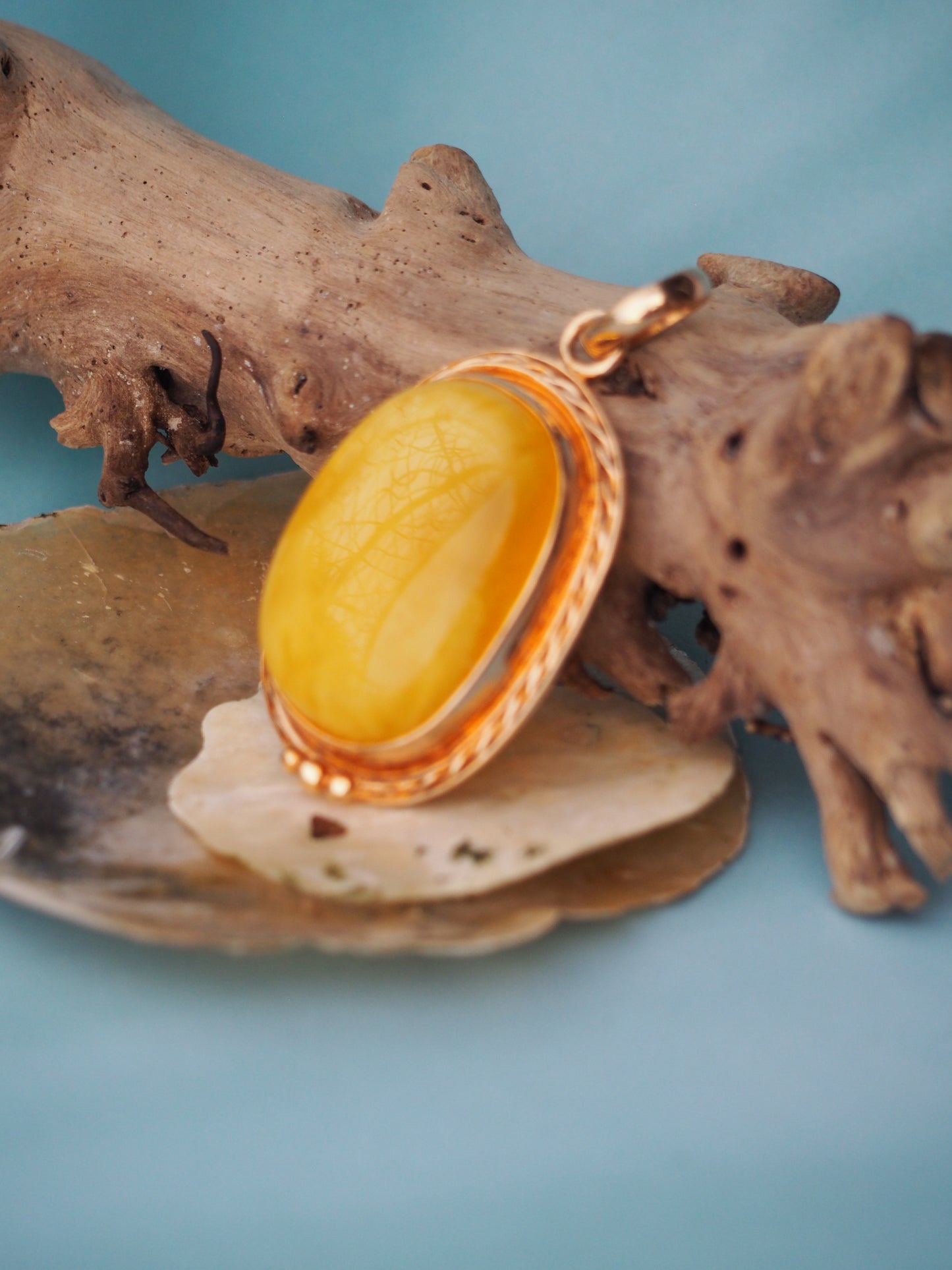 Butterscotch Amber Pendant in Rose Gold Pleated Silver Frame