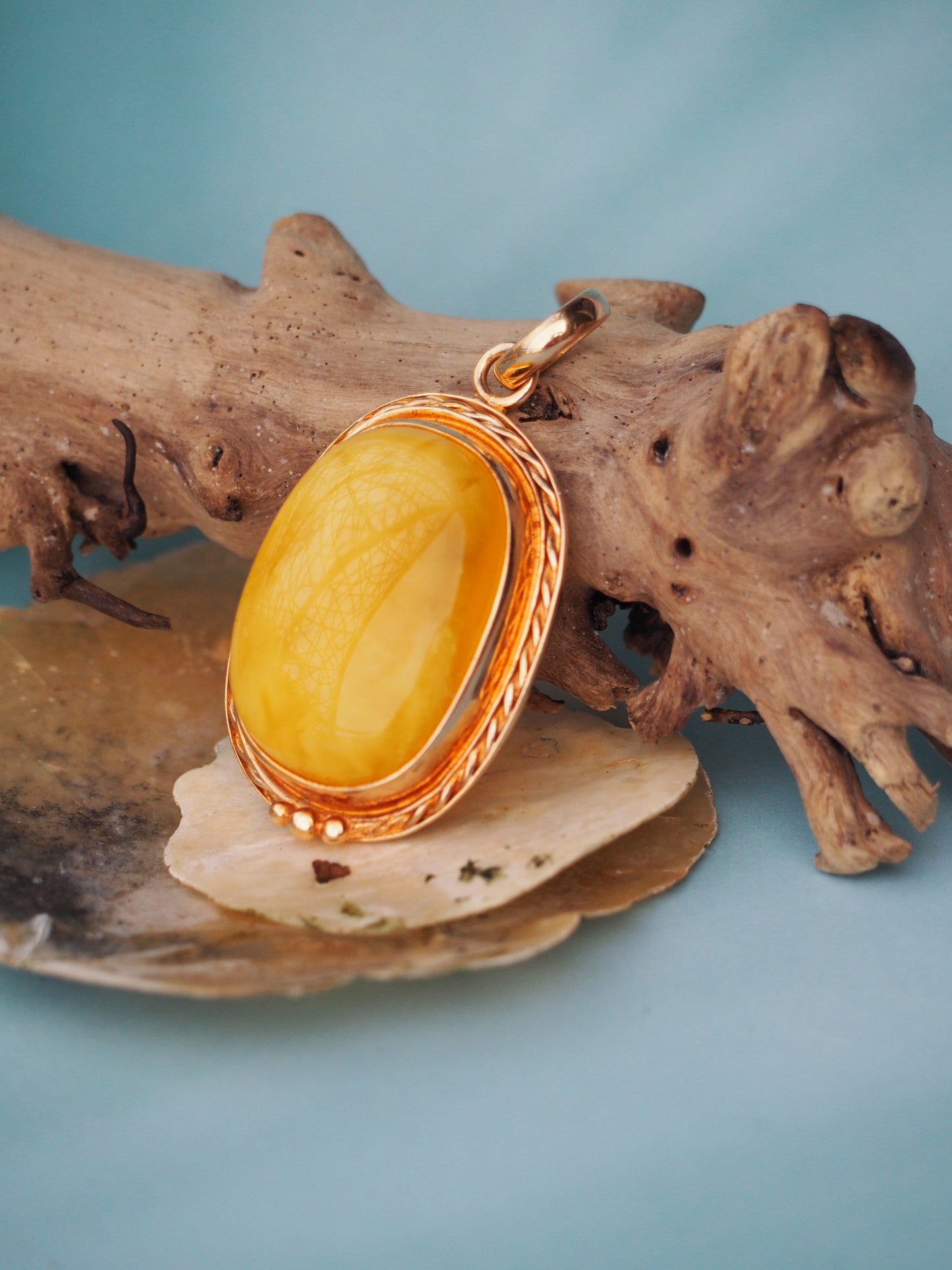 Butterscotch Amber Pendant in Rose Gold Pleated Silver Frame